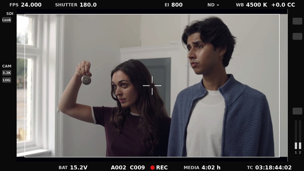 Nekki Sehmbi on set, camera monitor frame