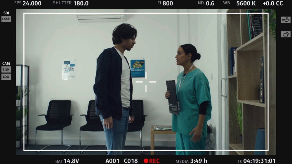 Nekki Sehmbi on set, camera monitor frame